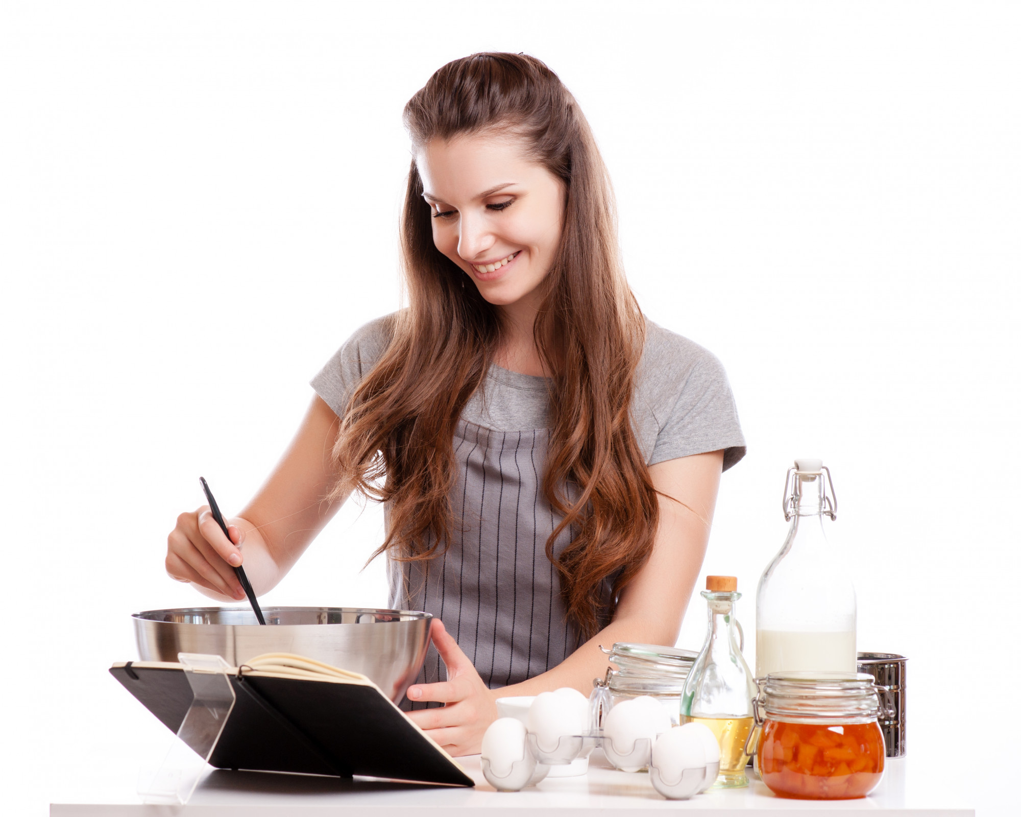 Student cooking at home with laptop guidance